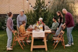 multi-generational family sharing an outdoor meal